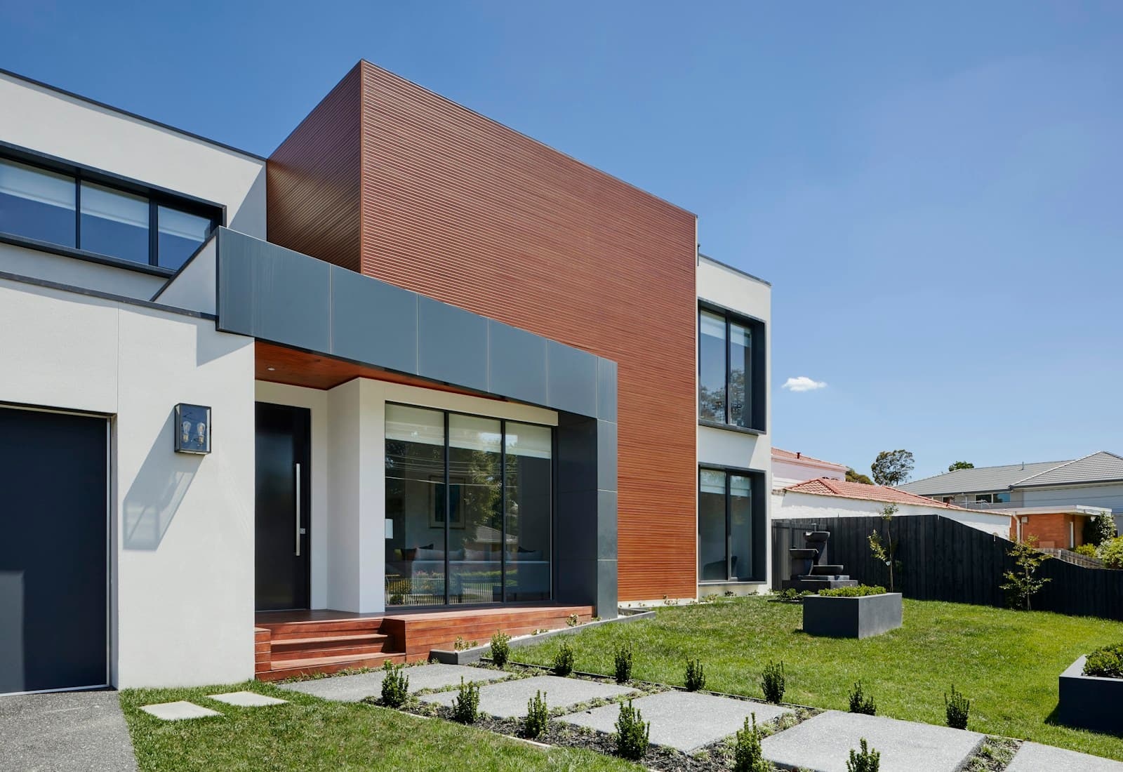 Illustrative residential architecture with a landscaped garden